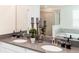 Elegant bathroom featuring double sinks, gray countertops, and a walk-in shower at 4501 Target Blvd, Kissimmee, FL 34746