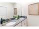 Bathroom featuring double sinks, modern fixtures, and a decorative mirror at 4501 Target Blvd, Kissimmee, FL 34746