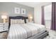 Comfortable bedroom with neutral color scheme, decorative pillows, and modern furnishings at 4501 Target Blvd, Kissimmee, FL 34746