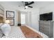 Bright bedroom with neutral colors, stylish artwork, and a comfortable ambiance at 4501 Target Blvd, Kissimmee, FL 34746