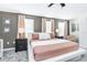 Neutral bedroom with a king platform bed, ambient lighting, and decorative accents at 4501 Target Blvd, Kissimmee, FL 34746