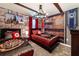 This bedroom boasts a Harry Potter theme with a stone wall mural and two beds with red accents at 4501 Target Blvd, Kissimmee, FL 34746