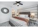 Stylish bedroom with a patterned accent wall, plush headboard, and decorative mirror at 4501 Target Blvd, Kissimmee, FL 34746