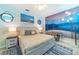 Charming bedroom with blue tones, beach themed decorations, and a king size bed at 4501 Target Blvd, Kissimmee, FL 34746