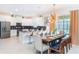 The kitchen and dining area features stainless steel appliances and seating for many at 4501 Target Blvd, Kissimmee, FL 34746