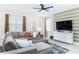 Cozy living room with sectional sofa, mounted TV, and stylish interior design at 4501 Target Blvd, Kissimmee, FL 34746