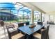 Covered patio overlooking the pool and spa includes outdoor dining and lounging areas at 4501 Target Blvd, Kissimmee, FL 34746