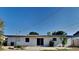 A charming single-story home featuring a white exterior and sliding glass doors leading to a spacious backyard at 4510 Ravinnia Dr, Orlando, FL 32809