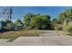 The backyard features a garage and green plants at 4510 Ravinnia Dr, Orlando, FL 32809