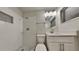 Updated bathroom with a tiled walk-in shower, and modern vanity at 4510 Ravinnia Dr, Orlando, FL 32809