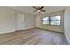 Bedroom with light laminate flooring, fresh paint and a ceiling fan at 4510 Ravinnia Dr, Orlando, FL 32809