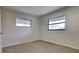 Bedroom featuring neutral carpet, windows and fresh paint at 4510 Ravinnia Dr, Orlando, FL 32809