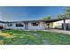 Charming single-story home with a well-maintained lawn and covered carport at 4510 Ravinnia Dr, Orlando, FL 32809