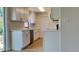Modern kitchen with stainless steel appliances, new countertops, and ample cabinet space at 4510 Ravinnia Dr, Orlando, FL 32809