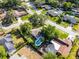 Aerial view of home with pool and mature trees in a residential neighborhood at 456 Willowbrook Ln, Longwood, FL 32779