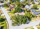 Aerial view of home with pool, mature trees, and surrounding neighborhood at 456 Willowbrook Ln, Longwood, FL 32779