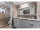 Elegant bathroom featuring a double sink vanity with marble countertop and a walk-in shower at 456 Willowbrook Ln, Longwood, FL 32779