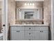 Elegant bathroom with double sink vanity, granite countertops, and brick-like wall tiling at 456 Willowbrook Ln, Longwood, FL 32779