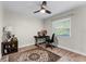 Bedroom featuring a ceiling fan, hardwood floors, and a sunny window at 456 Willowbrook Ln, Longwood, FL 32779