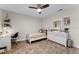Cozy bedroom featuring a ceiling fan, wood-look floors, a dresser, and large area rug at 456 Willowbrook Ln, Longwood, FL 32779
