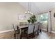 Dining room with modern table set, light fixture, and large windows at 456 Willowbrook Ln, Longwood, FL 32779