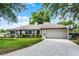 Charming single-story home with well-kept lawn, attached garage, and inviting curb appeal at 456 Willowbrook Ln, Longwood, FL 32779