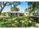 Charming single-story home boasts a well-manicured lawn and inviting curb appeal at 456 Willowbrook Ln, Longwood, FL 32779