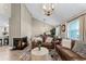 Inviting living room with fireplace, comfortable seating, and stylish décor, adjacent to dining area at 456 Willowbrook Ln, Longwood, FL 32779