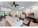 Bright living room featuring a skylight, TV, and seamless layout at 456 Willowbrook Ln, Longwood, FL 32779