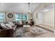 Open-concept living room with natural light, a comfortable seating area, and stylish design details at 456 Willowbrook Ln, Longwood, FL 32779