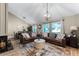 Inviting living room features vaulted ceilings, a cozy fireplace, and a stylish round center table at 456 Willowbrook Ln, Longwood, FL 32779
