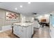 View of the living area with an island that has white cabinetry and granite countertops at 456 Willowbrook Ln, Longwood, FL 32779