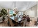 Dining room flows into living space, offering abundant natural light and stylish furnishings at 456 Willowbrook Ln, Longwood, FL 32779