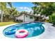 Backyard with a private pool, perfect for relaxation and summer fun, surrounded by a fenced yard at 456 Willowbrook Ln, Longwood, FL 32779