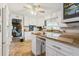 Bright kitchen with white cabinets, granite countertops, and stainless steel appliances at 5547 Kingswood Dr, Orlando, FL 32810