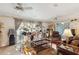 Cozy living room with a ceiling fan, curtains, and lots of musical instruments at 5547 Kingswood Dr, Orlando, FL 32810