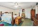 Comfortable bedroom with a traditional four-poster bed and ample closet space at 5547 Kingswood Dr, Orlando, FL 32810