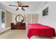 A cozy bedroom features natural light and a large dresser at 728 E Clifford Ave, Eustis, FL 32726
