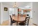 Cozy dining area connected to the kitchen, perfect for Gathering meals and entertaining guests at 728 E Clifford Ave, Eustis, FL 32726