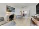 The living room features tile floors, a ceiling fan, and access to the dining area at 728 E Clifford Ave, Eustis, FL 32726