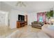 Cozy living room showcasing comfortable seating, tile flooring, and a warm, inviting atmosphere at 728 E Clifford Ave, Eustis, FL 32726