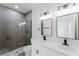 Modern bathroom featuring double sinks and glass door shower at 741 Marion Oaks Ln, Ocala, FL 34473
