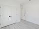 Spacious bedroom with closet and wood-like flooring, providing a comfortable and stylish living space at 741 Marion Oaks Ln, Ocala, FL 34473