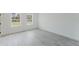 Bright bedroom featuring two windows and light gray flooring at 741 Marion Oaks Ln, Ocala, FL 34473