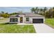 Beautiful single-story home boasts a modern design and well-manicured lawn at 741 Marion Oaks Ln, Ocala, FL 34473