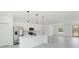 Modern kitchen showcasing white cabinetry, a stainless steel refrigerator, and sleek countertops for meal preparation at 741 Marion Oaks Ln, Ocala, FL 34473