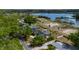 An aerial view of the property near a lake, showing its position on a well-maintained street with a private pool at 789 Errol Pkwy, Apopka, FL 32712