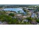 An aerial shot of the property, ideally located near a scenic lake, highlighting its private pool and community setting at 789 Errol Pkwy, Apopka, FL 32712