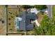Overhead view of the property showcasing the roof, backyard, pool, and driveway at 789 Errol Pkwy, Apopka, FL 32712