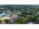 An aerial view of the property in a neighborhood setting, with mature trees and proximity to a body of water at 789 Errol Pkwy, Apopka, FL 32712